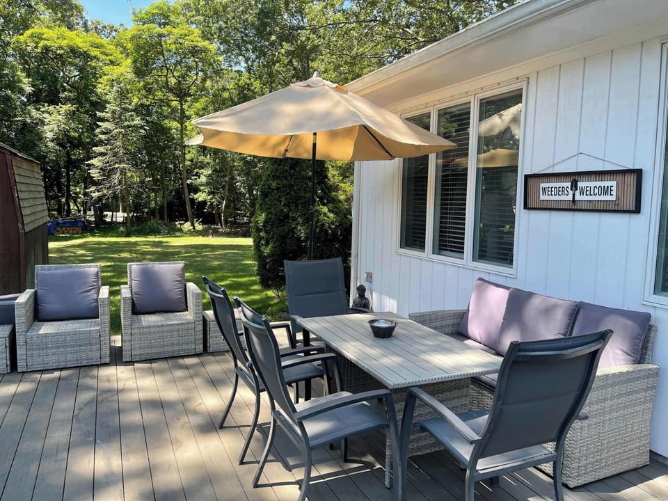Private deck with outdoor dining and summer seating