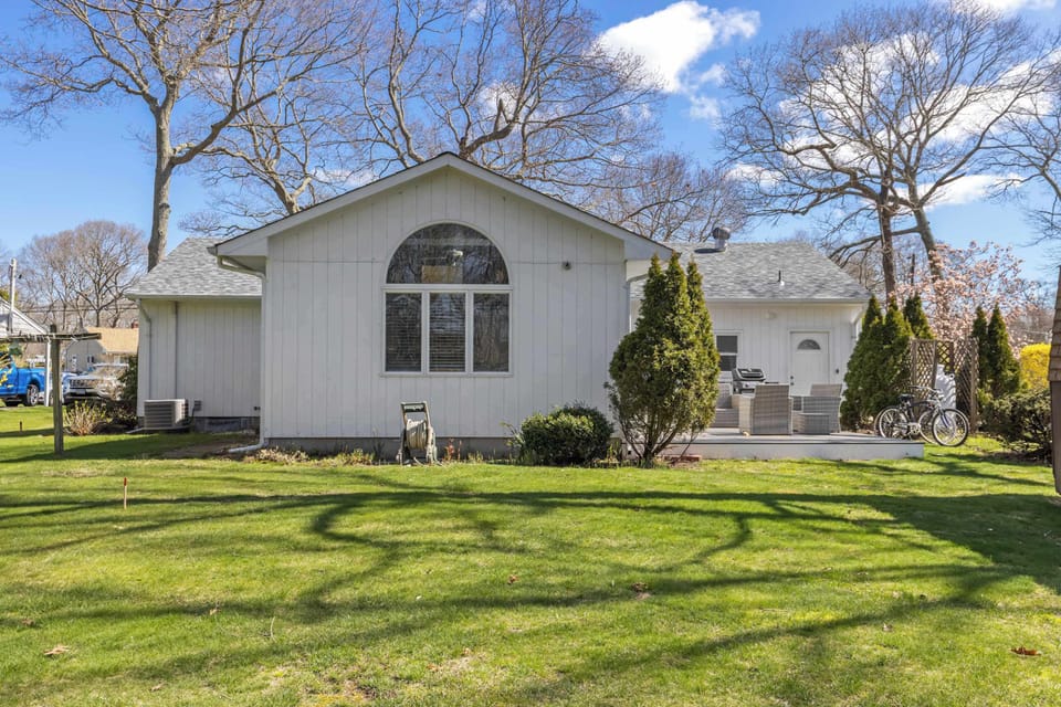 Spacious fenced backyard with deck