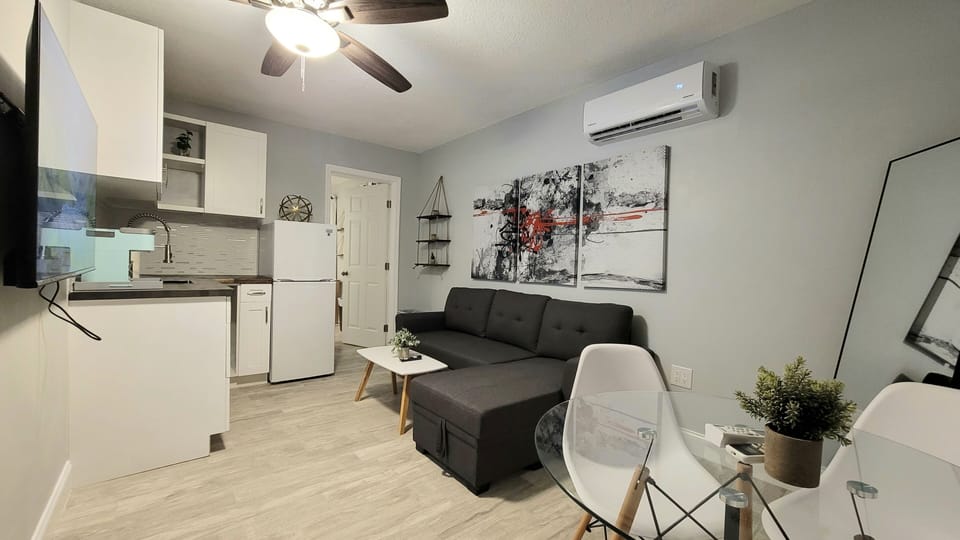 Luxury Suite | Living area | 40-inch Smart TV with digital channels, TV, Netflix