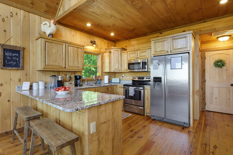 Fully stocked kitchen with dishwasher, oven/stove, coffee makers, toaster.