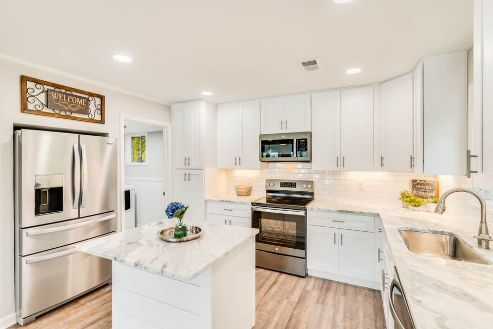 Bright kitchen is stocked with everything you will need after a day on the lake.