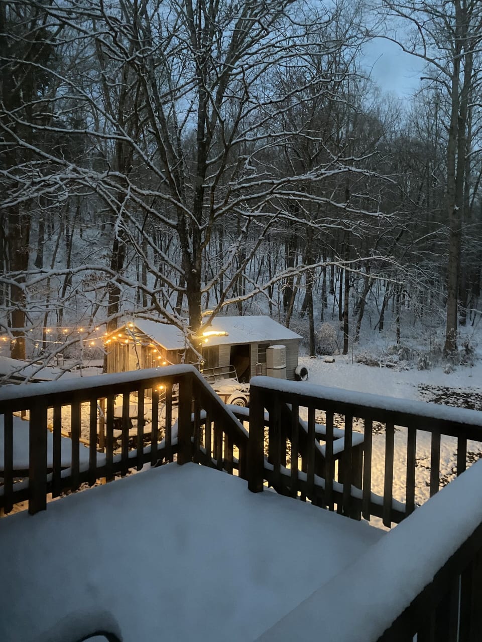 Back upstairs deck overlooking the snow and creek. 