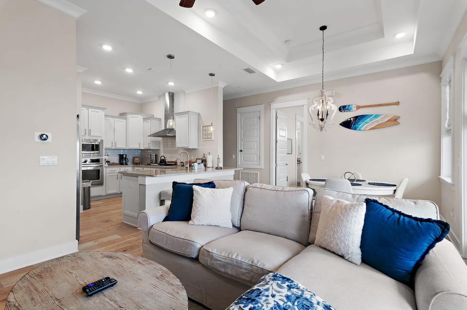 Relaxing coastal living with plush sectional seating and an open floor plan.