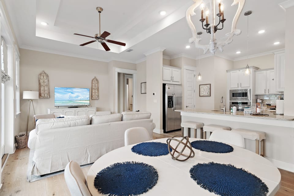 Dining area flows seamlessly to the chef-inspired kitchen and living room.