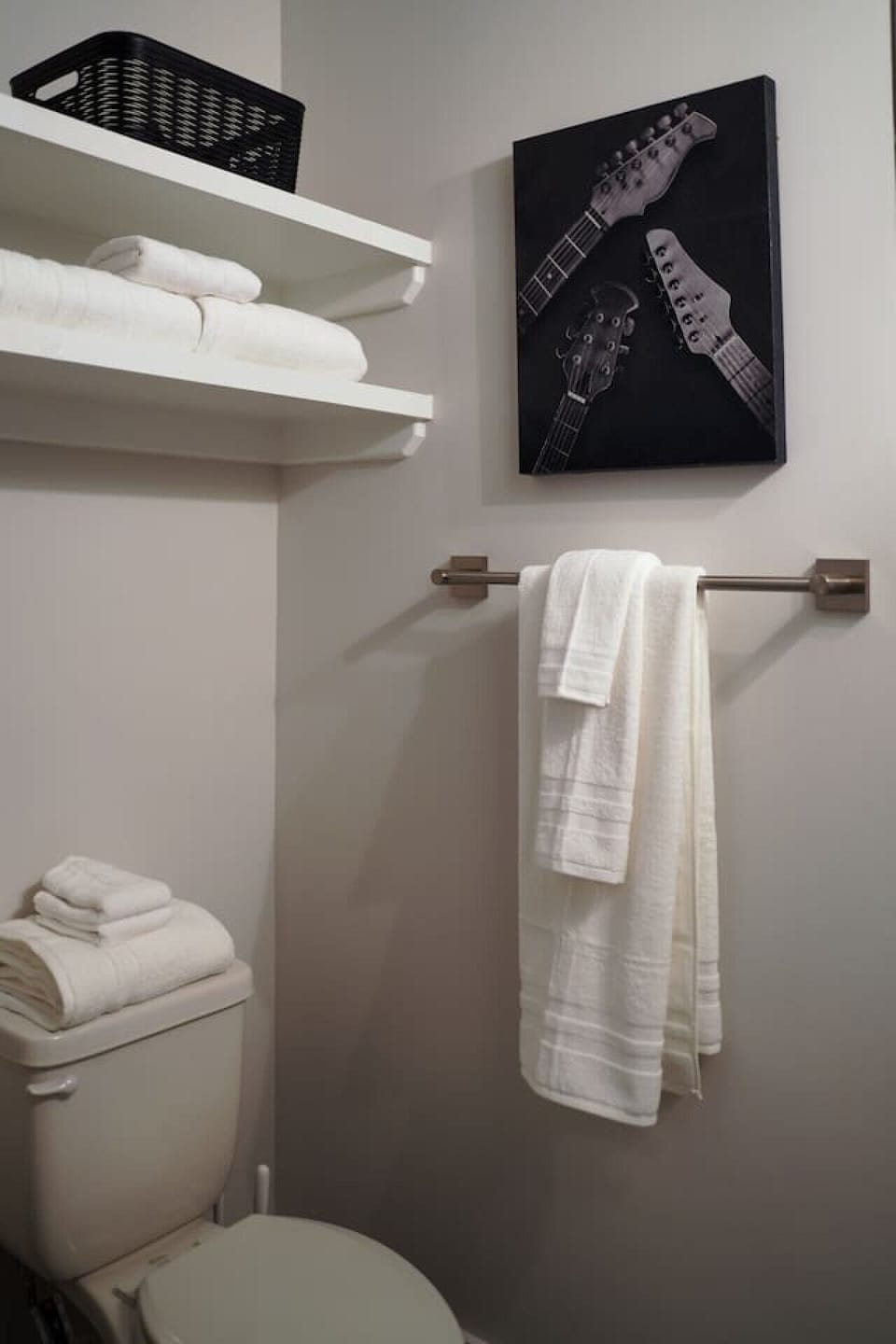 Primary bedroom featuring a private ensuite full bathroom