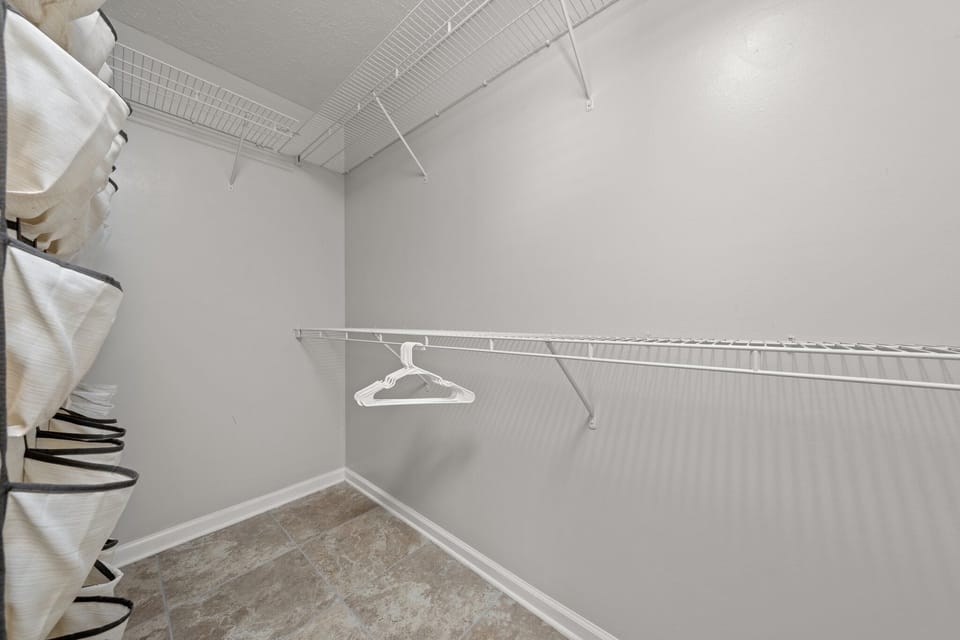 Walk-in master bedroom closet.