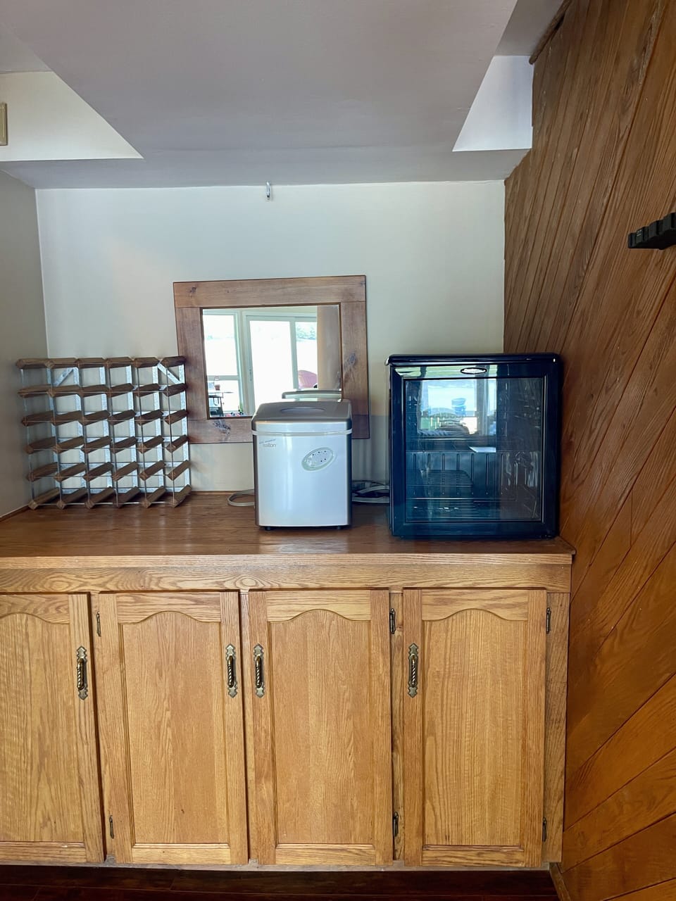 Ice machine and wine fridge. There is also a stand up freezer and  second fridge