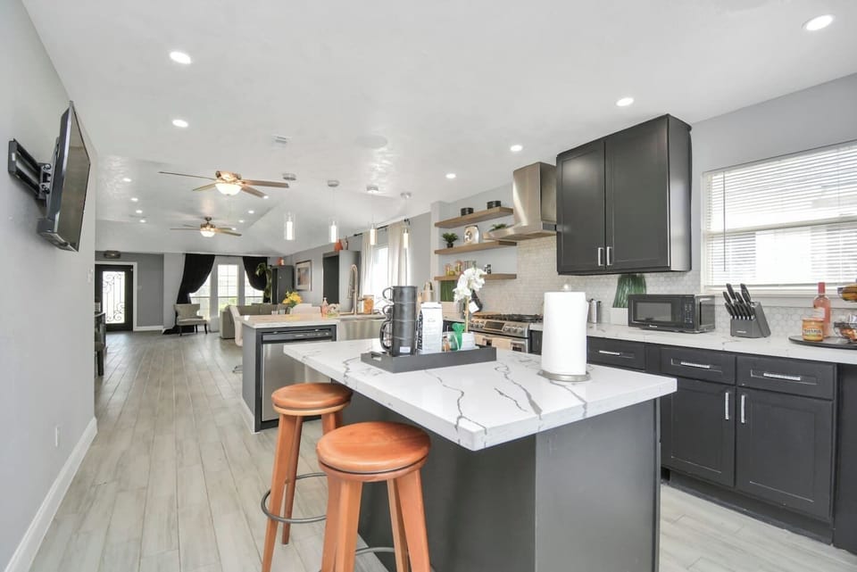 Enjoy the convenience of a fully stocked kitchen where you can cook, snack, or simply gather together. It’s the perfect place to feel at home while exploring Houston.
