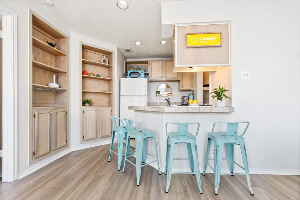 Counter seating around kitchen, kurig with variety of k cups, cream & sugar 