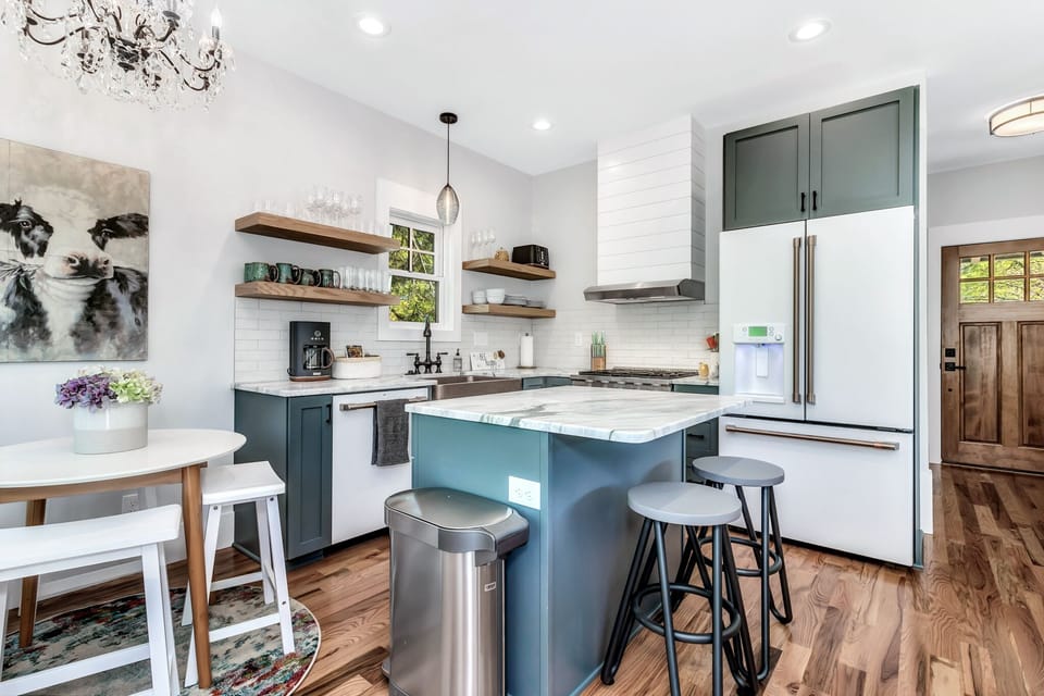 well equipped kitchen with gas range and dining