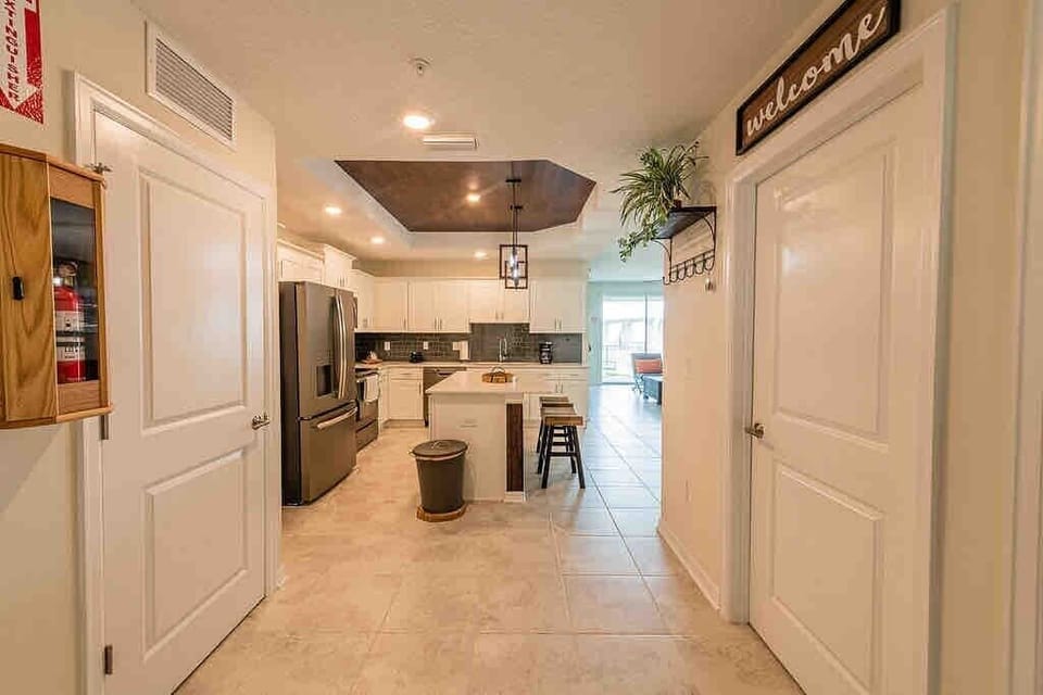 The fully equipped kitchen features modern appliances, sleek cabinetry, and all essential cookware and utensils, making it perfect for preparing meals with ease.