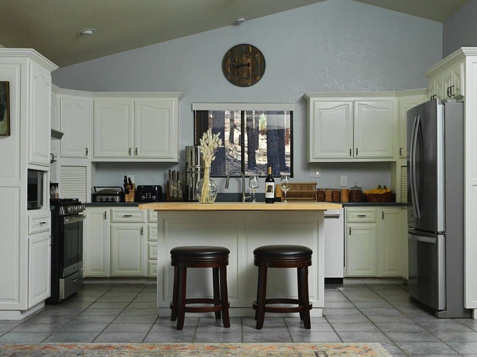 Unleash your inner chef in our well-appointed kitchen, designed for effortless food preparations. The ample counter space, highlighted by a large island, provides a perfect setting to showcase your culinary skills and prepare mouthwatering meals.
