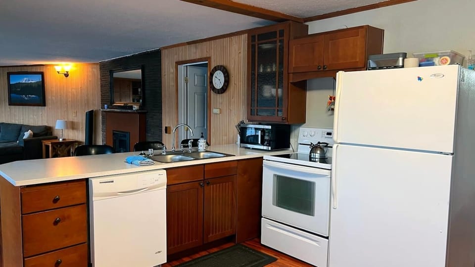 Unleash your inner chef with a full-size stove and fridge that's ready to handle any culinary masterpiece. Say goodbye to post-meal cleanup stress with a full-size dishwasher. Enjoy the convenience of effortlessly loading your dishes, allowing you to