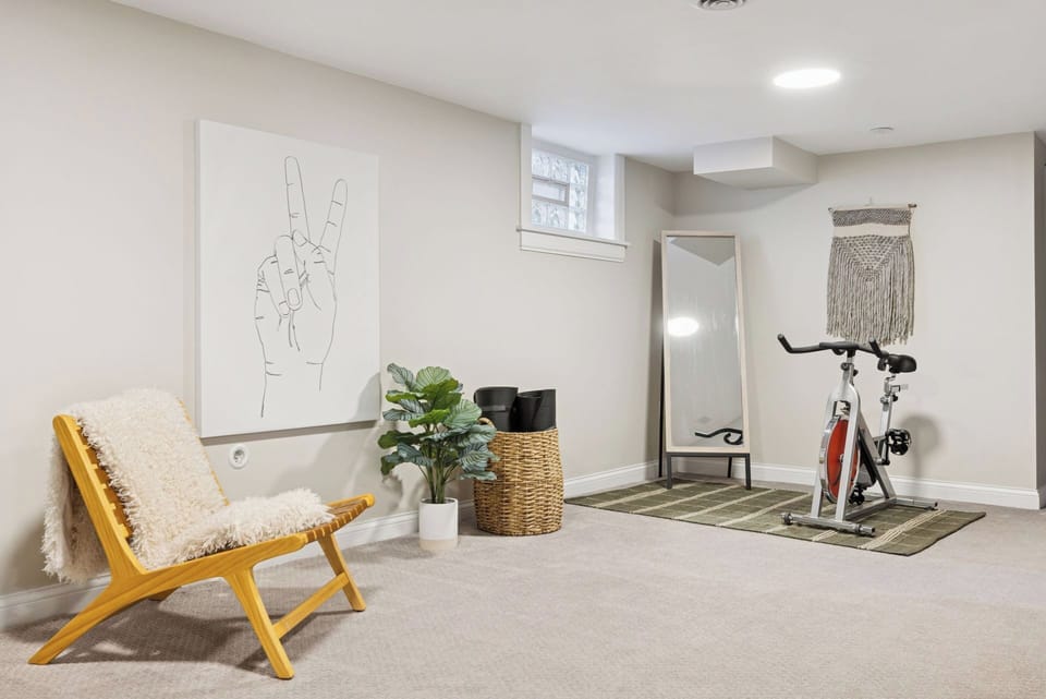 Spin bike and yoga mats. Access workout videos on the SMART TV.