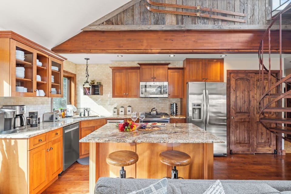 Spacious kitchen with stainless steel appliances.