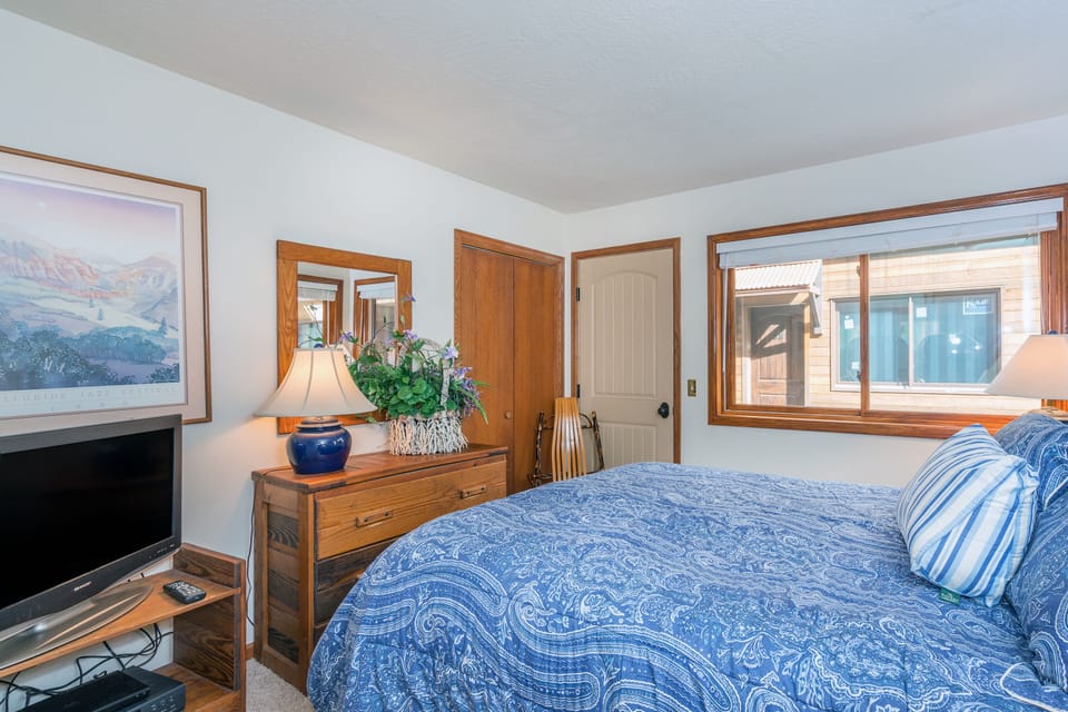 Bedroom 2 features a queen bed.