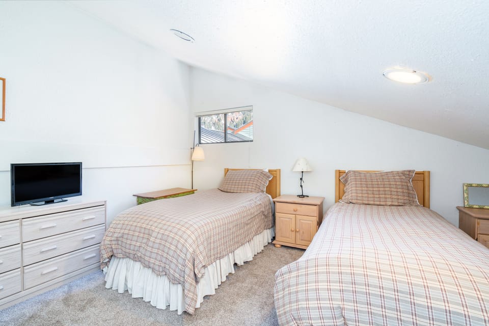Bedroom 2 features two twin beds.