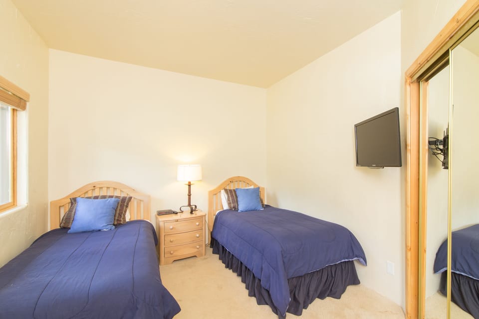 Bedroom 3 features two twin beds.