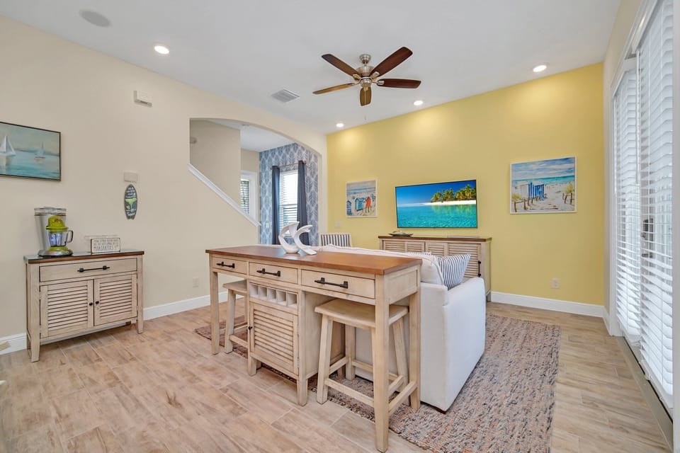 - Inviting living area of the cottage in Reunion Florida - Cozy seating area conducive to relaxation and socializing - Smart TV and Netflix - Artfully arranged decor elements, from wall art to decorative accessories