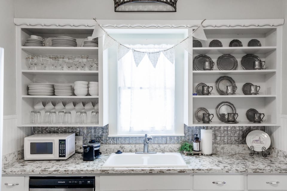 Bright, fully equipped kitchen, rich with historic charm