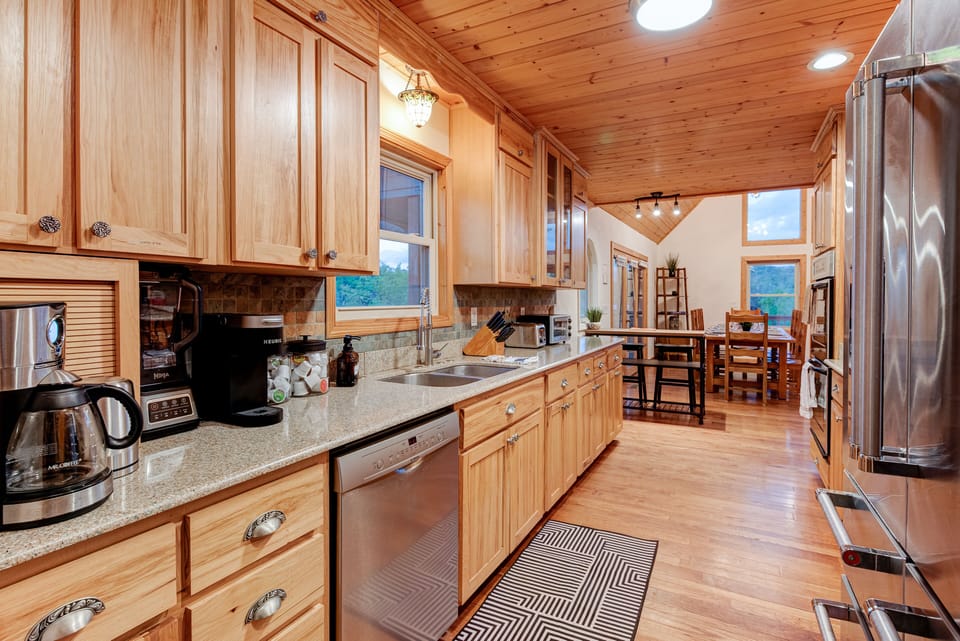 Main floor kitchen complete with drip coffee, Keurig, electric kettle, blender