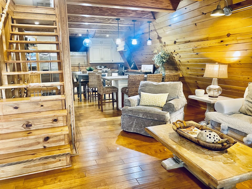 Living room with view into kitchen