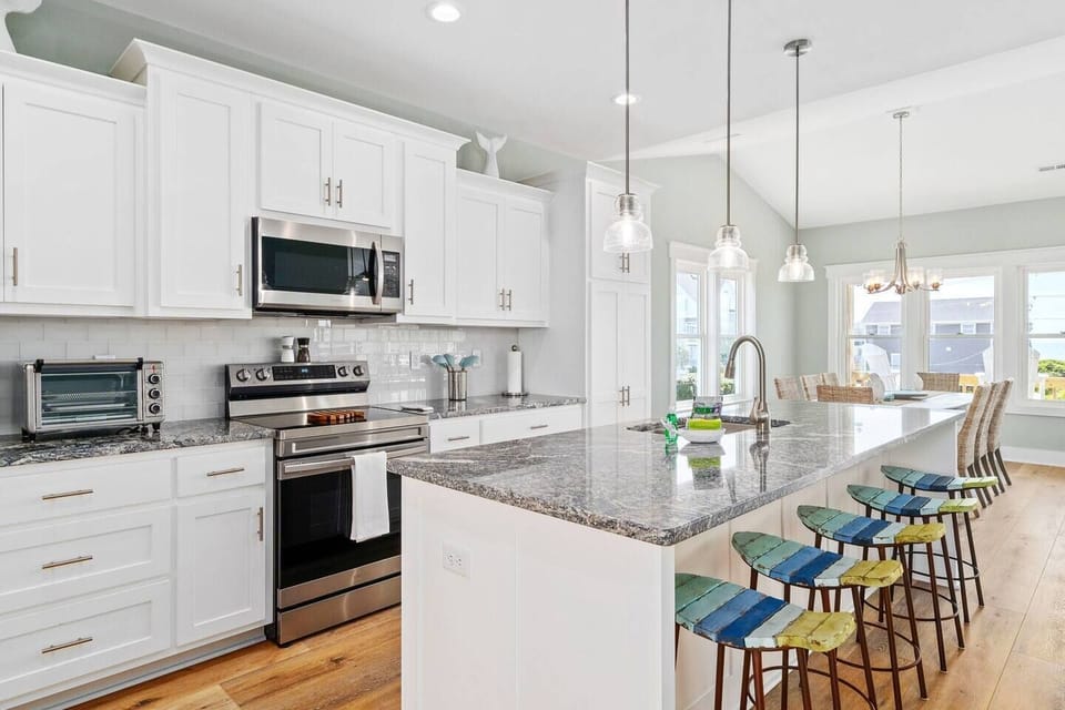 Fully-Equipped Kitchen with Ample Cookware and Utensils: A Spacious Island Perfect for morning waffles, pancakes from our waffle bar, and evenings of dining and entertaining!