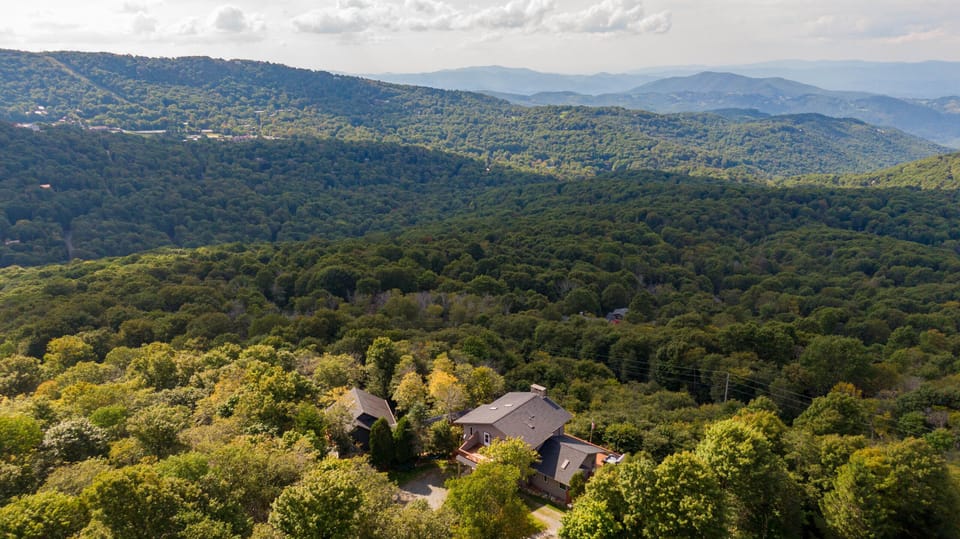 Perched above it all, surrounded by miles of Blue Ridge forest. This is your view from the summit.
