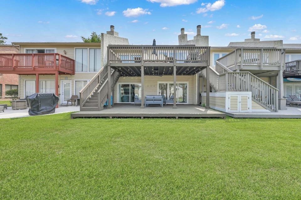 Gorgeous two-story deck for your family gatherings!  Access our paddle boards under the stairs, bring your fishing poles, use our lake floats to relax in the canal.