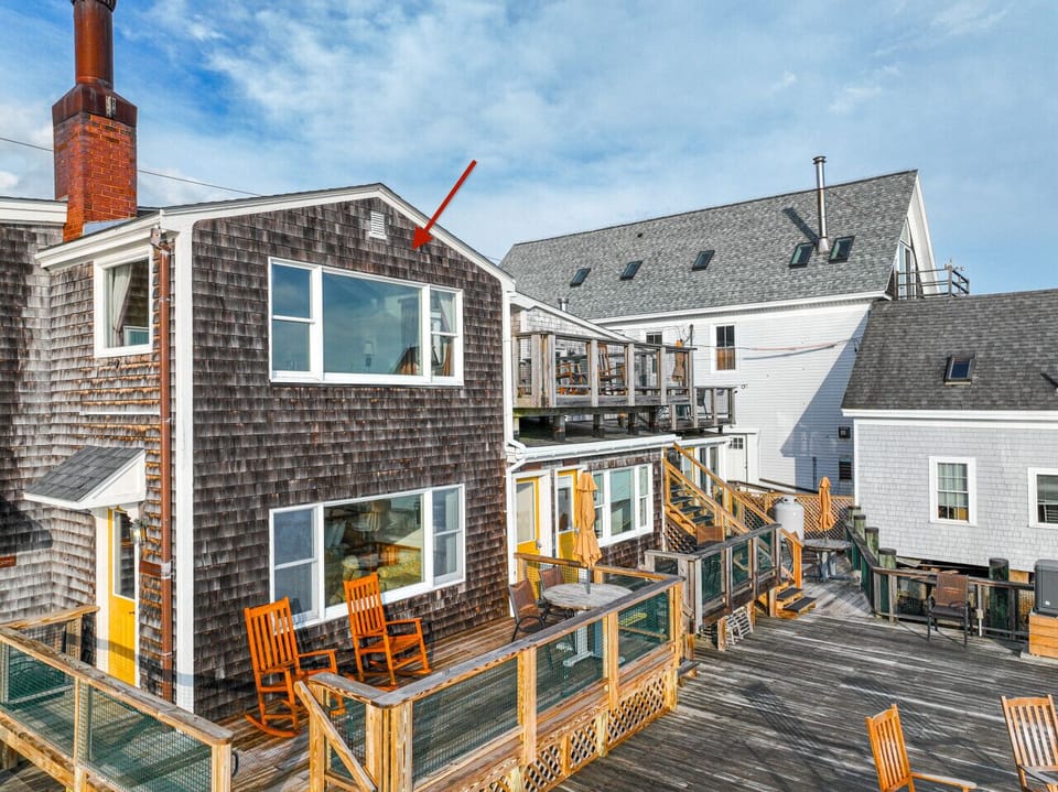 Perched on the second floor, this unit overlooks the harbor with a window perfectly positioned to capture the scenery—morning light on the water, passing boats, and the calm charm of coastal Maine.