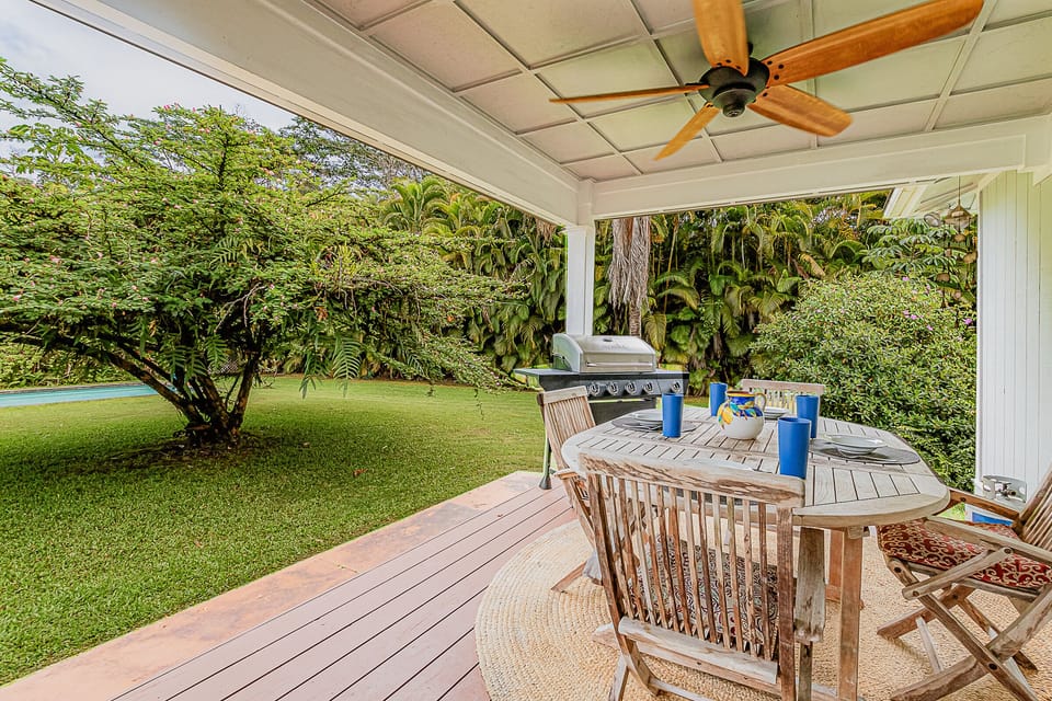 Shady lanai with grill, outdoor dining, ceiling fan