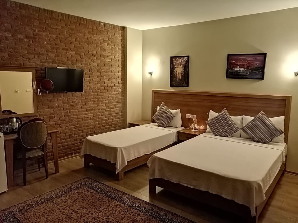 Deluxe Triple Room, Non Smoking, Mountain View | Premium bedding, minibar, desk, laptop workspace