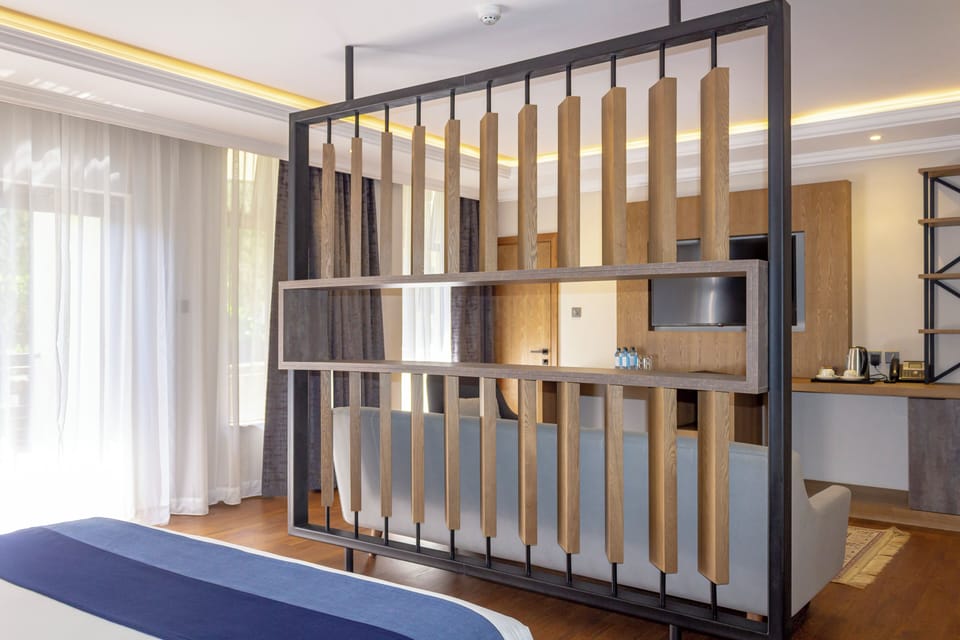 Junior Suite | Premium bedding, minibar, in-room safe, individually decorated