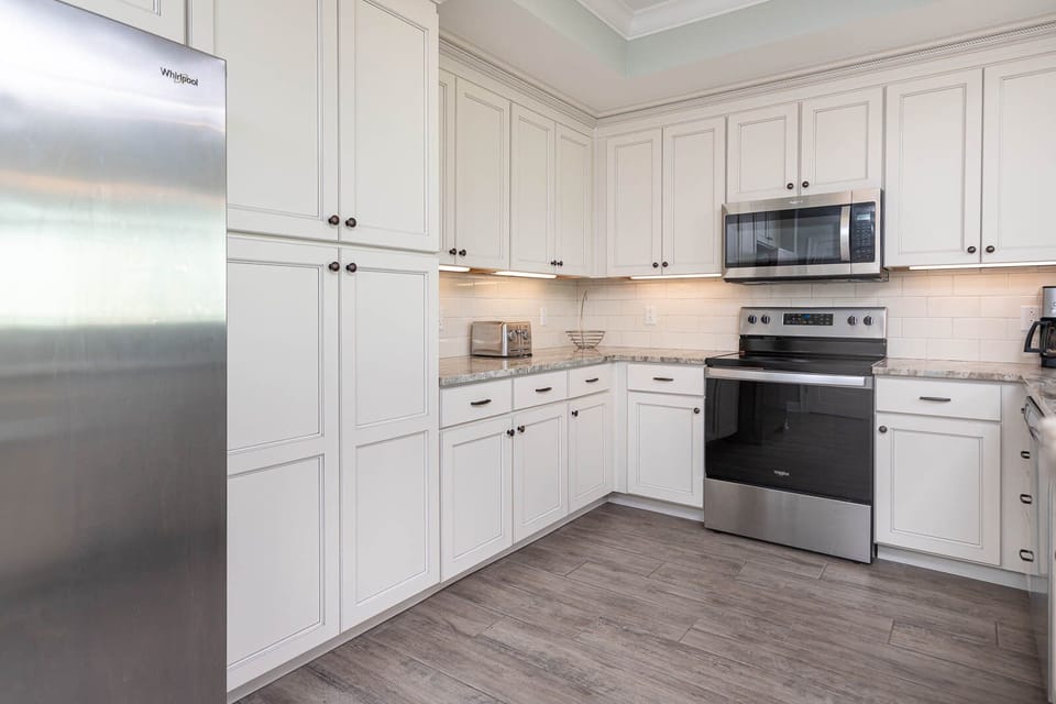 Create culinary delights in the kitchen, where you can enjoy the coastal ambiance as you cook and bond