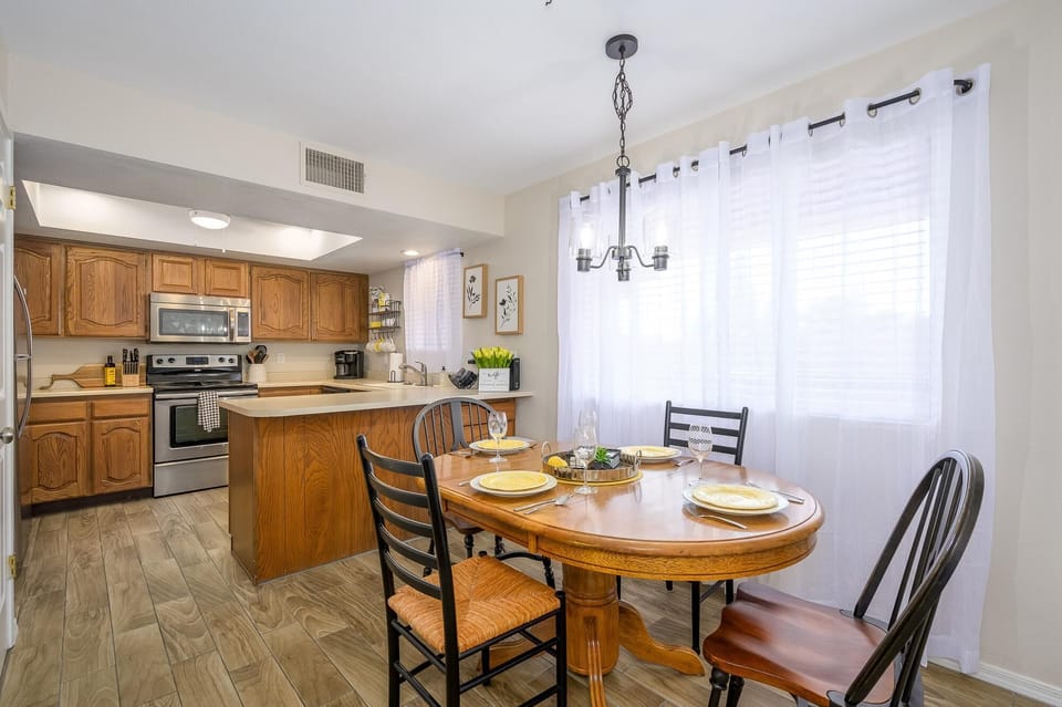 Large dining table that fits up to 6 chairs.