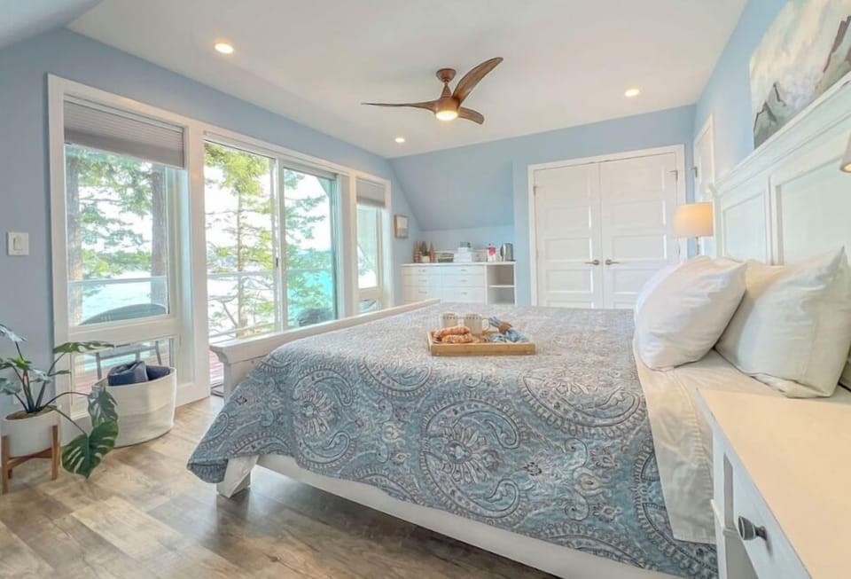 The King waterview master bedroom allows you to experience jaw-dropping sunrises & features a Smartlife mattress, high-end blackout shades, built-in storage, and an elevated private deck.  This is a premium sleep experience.