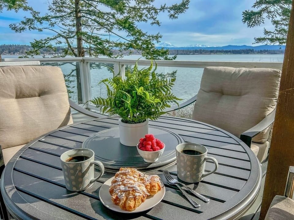 Gather the group on the deck - overstuffed chairs and cozy blankets make time spent outdoors pleasant, no matter the weather. PNW evenings are better surrounded by those you love. 