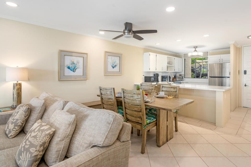 Open concept layout connects living room, dining area, and kitchen