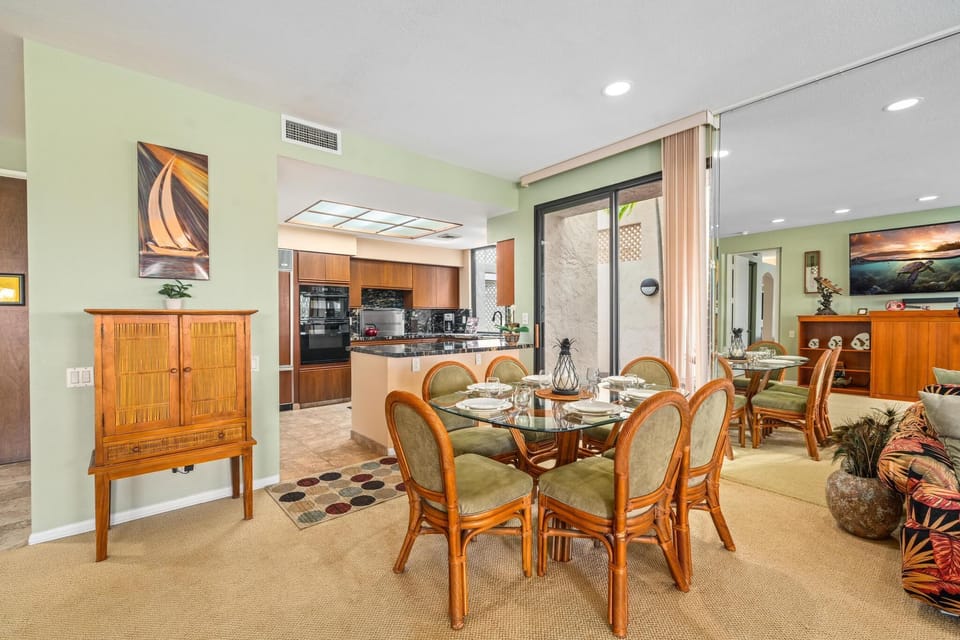 Dining area with glass top table and seating for six