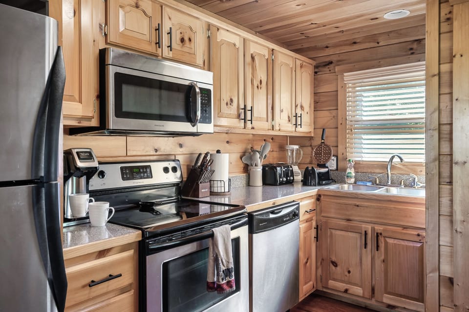 Functional kitchen with basic utensils and grill tools.