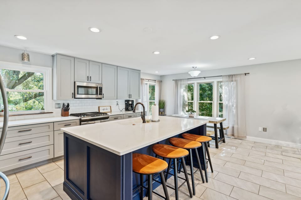 Kitchen with dining table and bar seating