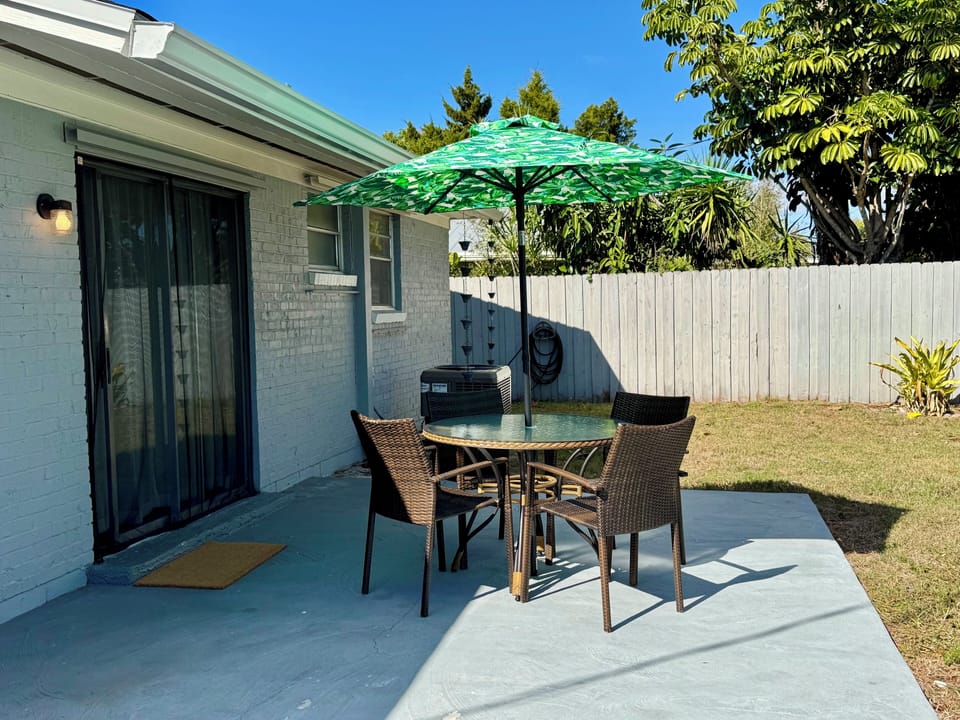 Backyard patio with outdoor patio set