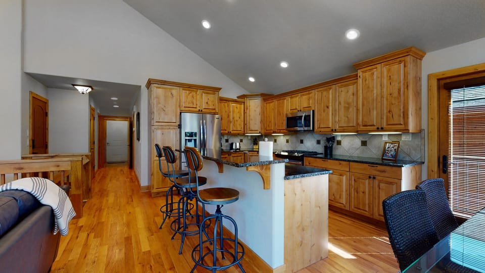 Kitchen with center island bar seating