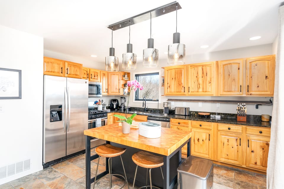 Gas stove, oven, dishwasher, pressure cooker, blender and cooking utensils.