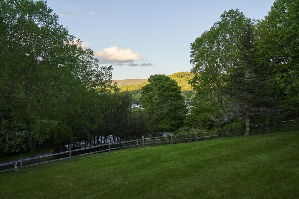 Mountain view from front porch overlooking fully fenced in yard