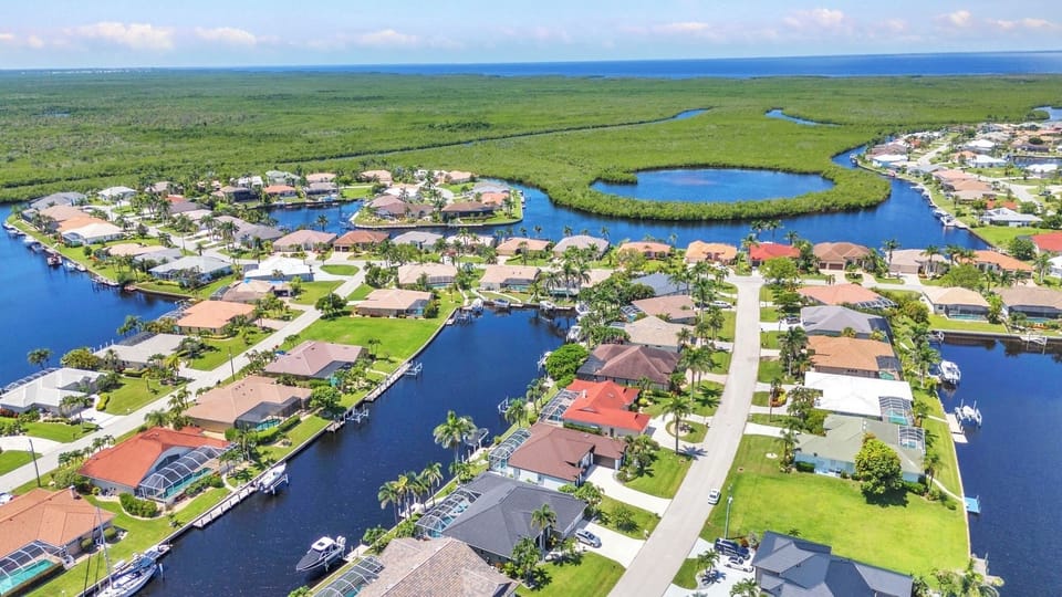 SURROUNDED BY WATER AND LUSH LANDSCAPING