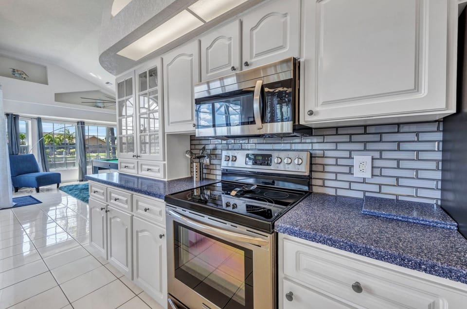 NEW STAINLESS APPLIANCES AND AMPLE CABINET AND COUNTER SPACE
