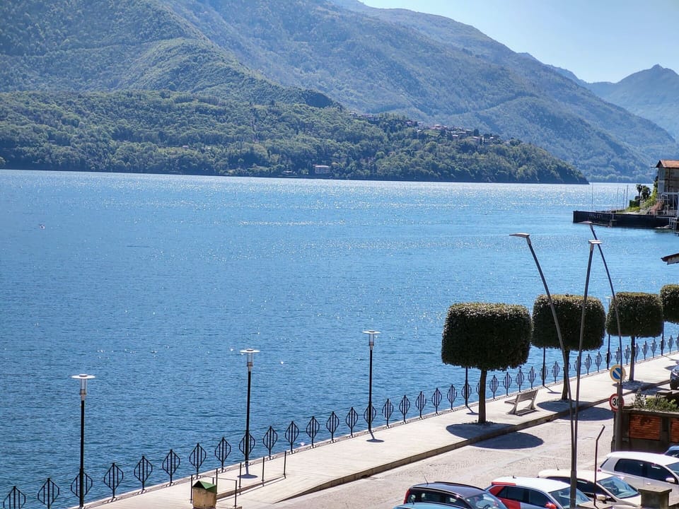 Water, Sky, Mountain, Azure, Wheel, Body Of Water, Street Light, Vehicle, Lake