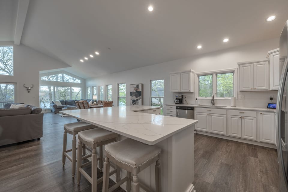 Brand new countertops and flooring grace the entirety of the fully equipped kitchen