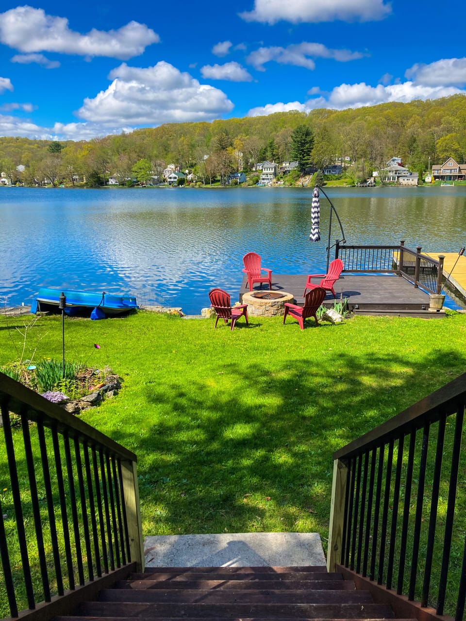 Walk down from the patio to the dock fire pit and lake 